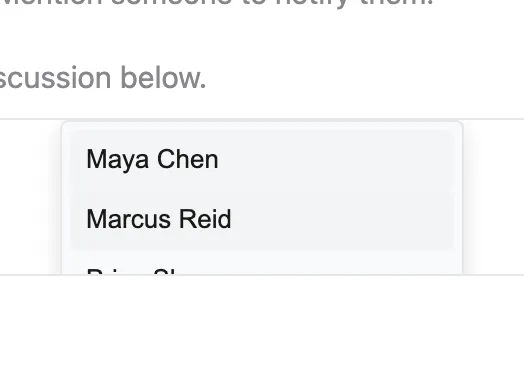 The mention suggestion popup cut off at the editor's bottom edge, with the third item half visible